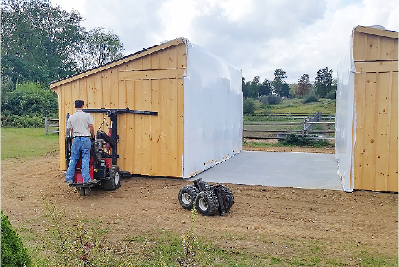 Putting A Modular Barn In Place Using A "Mule"